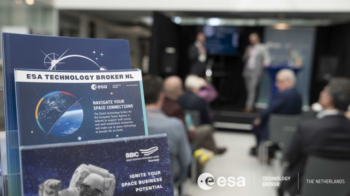 space business professionals presenting on stage